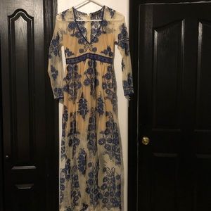 Vintage dress covered in navy blue laced design